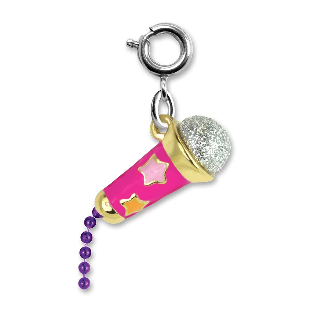 A charm featuring a pink and gold microphone with a silver glitter top and purple bead chain.
