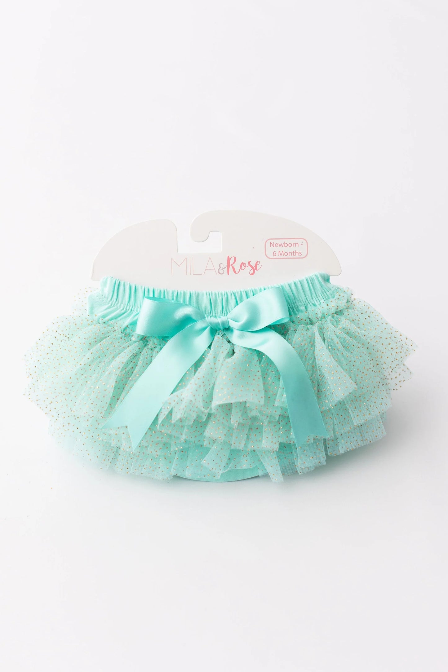 Turquoise tutu skirt with a bow on a white background