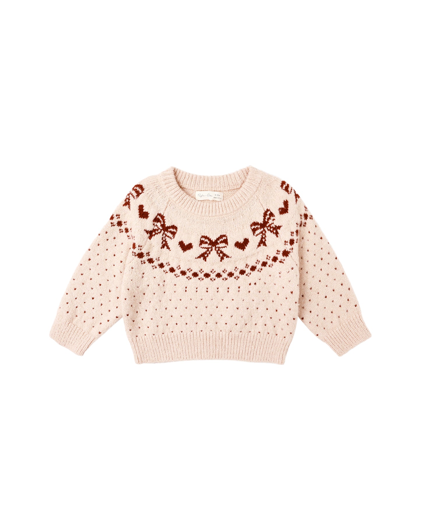 Pink sweater with bow and heart patterns