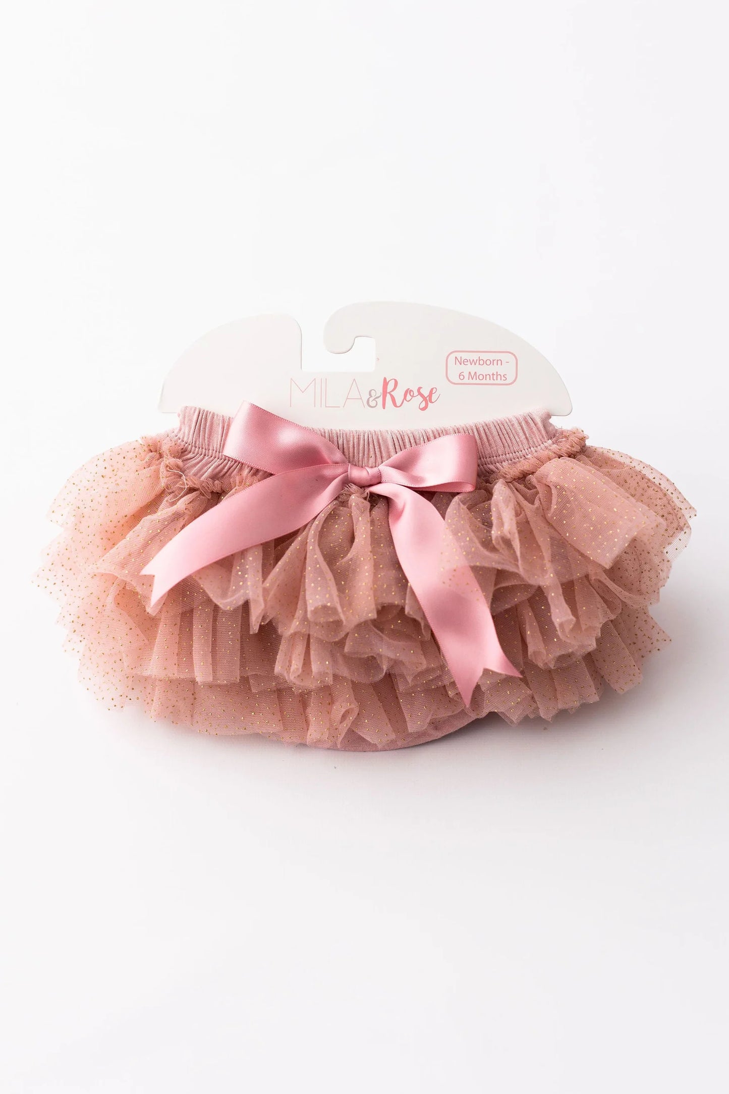 Pink tutu with a bow on a white background