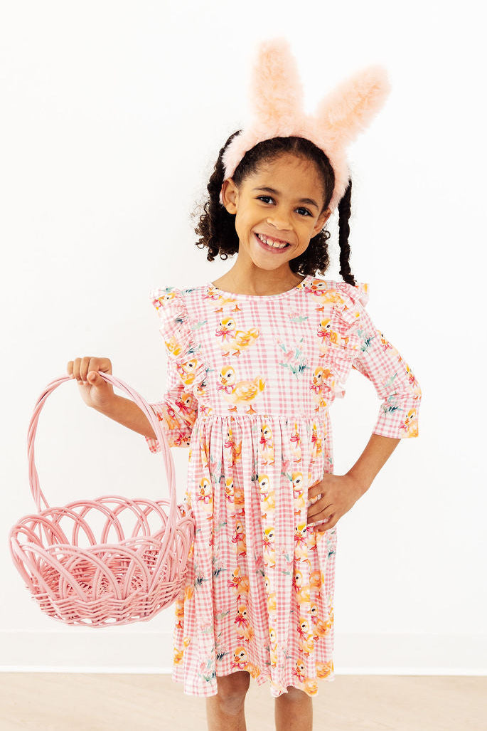 Plaid pink ruffle dress with ducklings