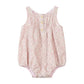 Pink floral baby romper on a white background
