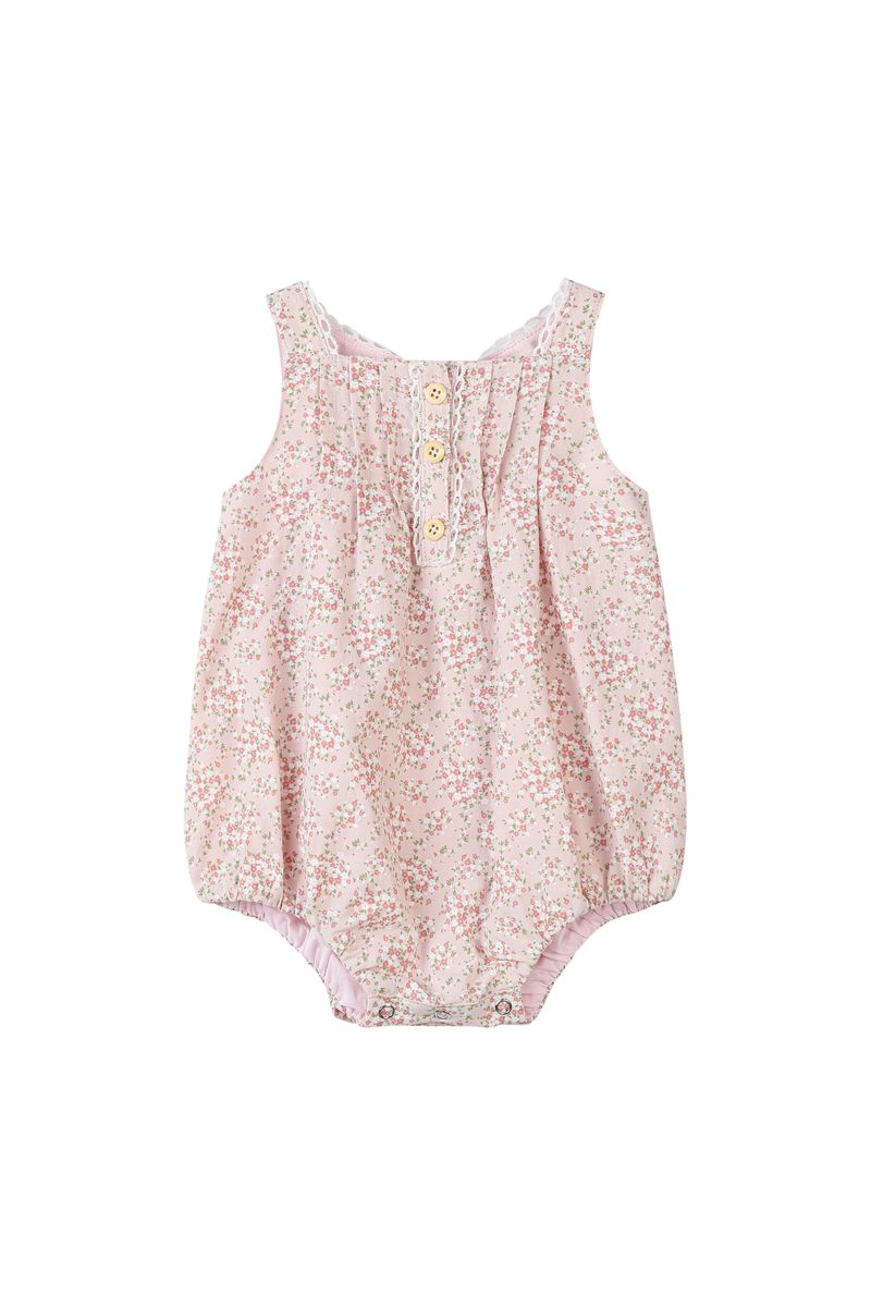 Pink floral baby romper on a white background