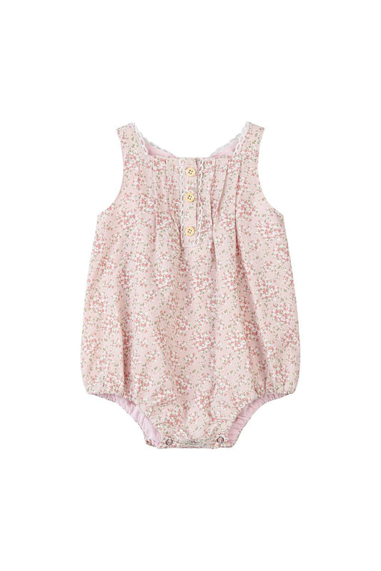 Pink floral baby romper on a white background