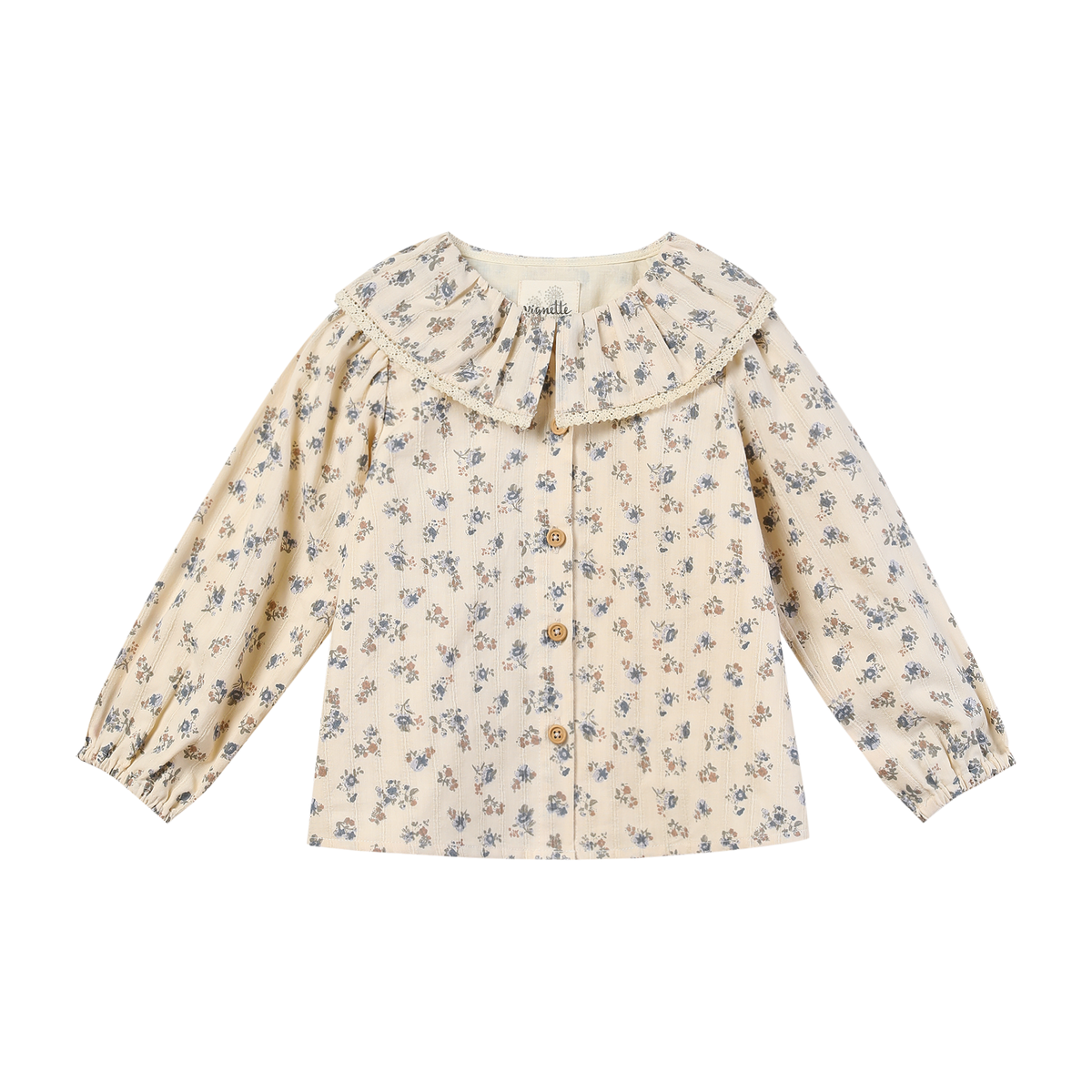 A long-sleeve cream-colored blouse for toddlers or girls, featuring a delicate blue and yellow floral print, a large ruffled collar, and a button-up front.