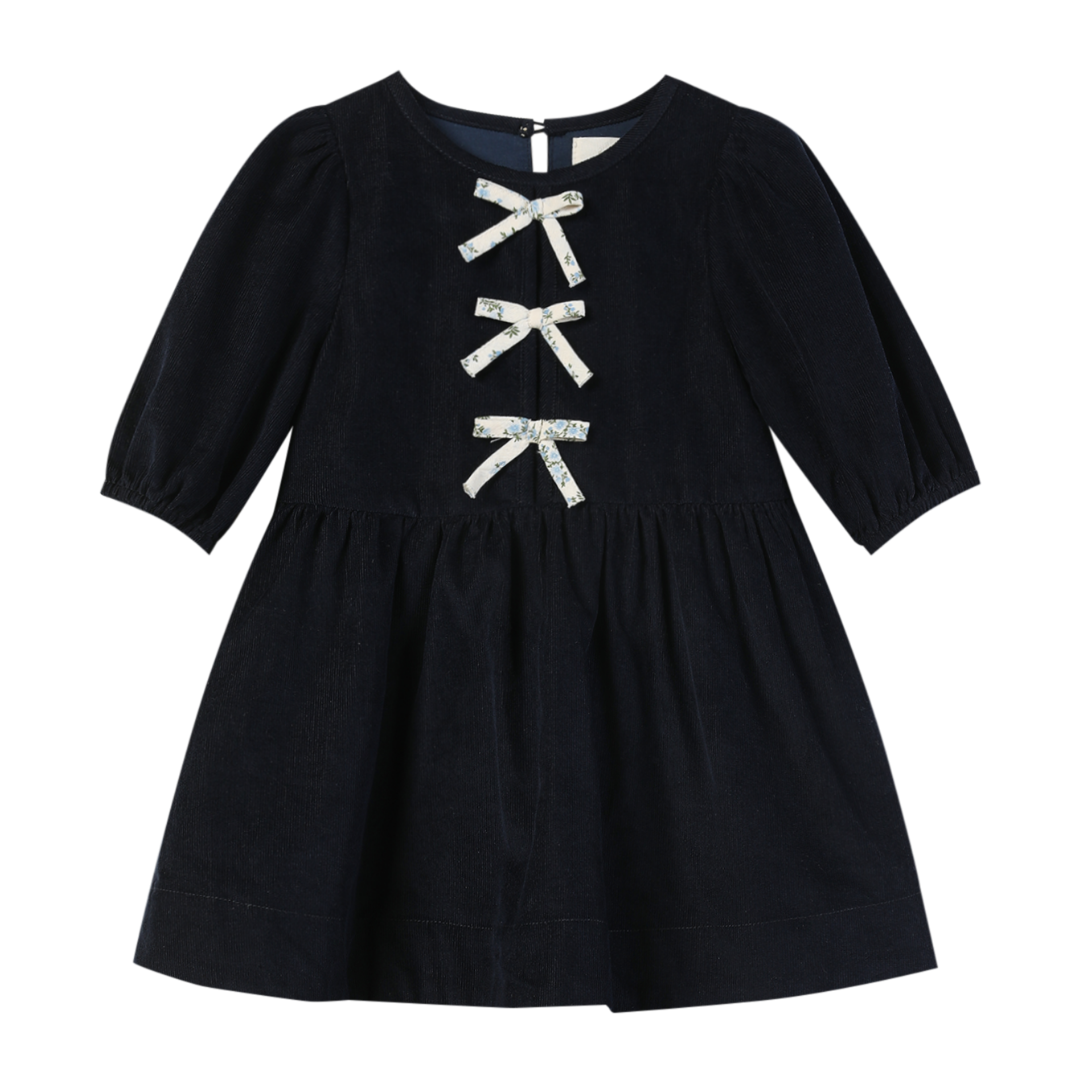 Deep blue dress with white bows on the front.