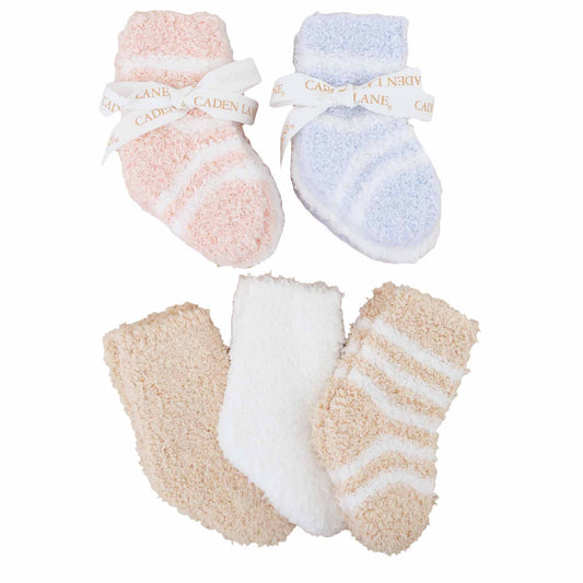 Set of baby socks in pink, blue, white, and beige with striped patterns 