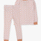 A two-piece children's pajama set featuring a long-sleeve top and matching pants in a white fabric with a repeating peach-orange paisley pattern, finished with solid peach-orange ribbed trim at the collar, cuffs, and hem.