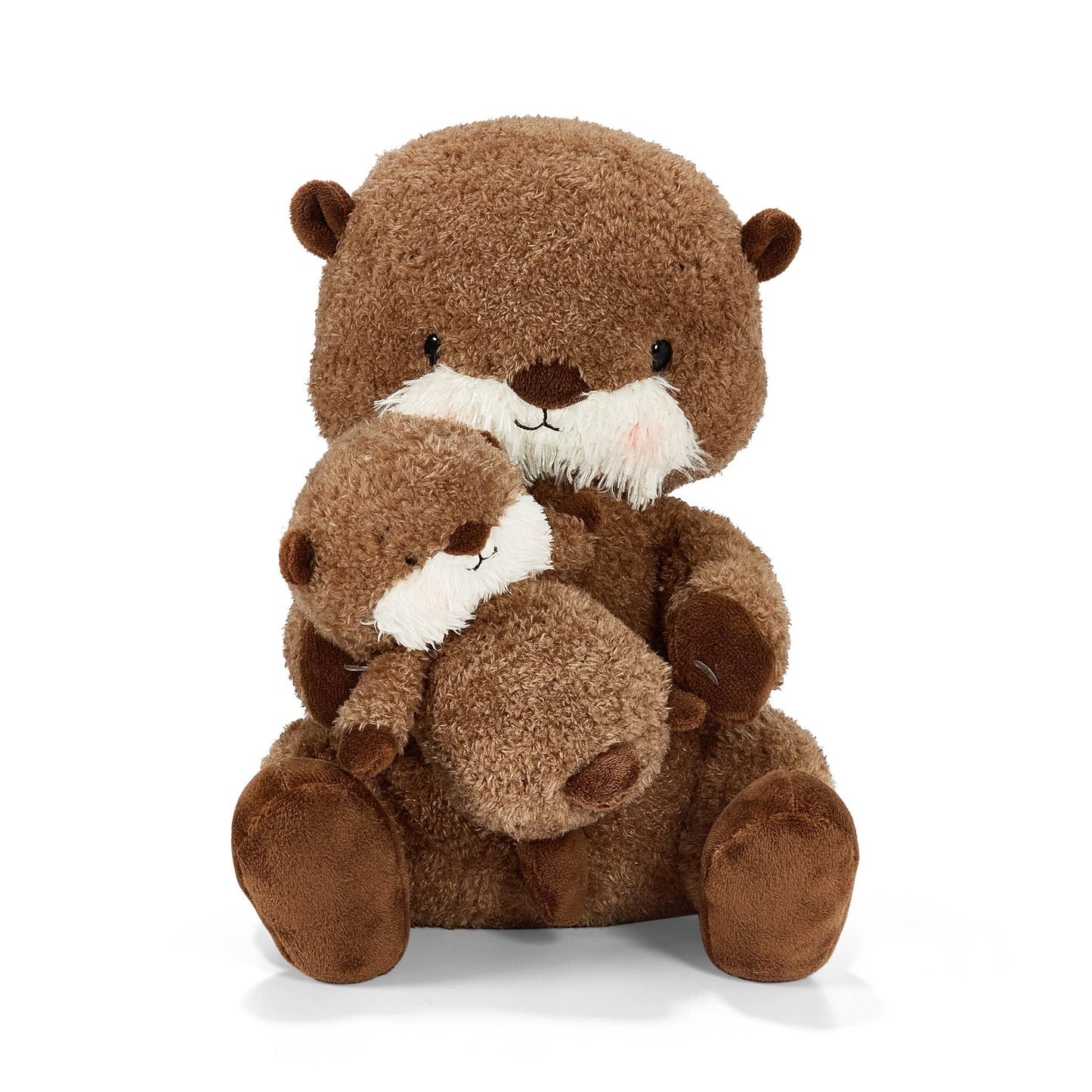 Two brown plush otters hugging each other on a white background