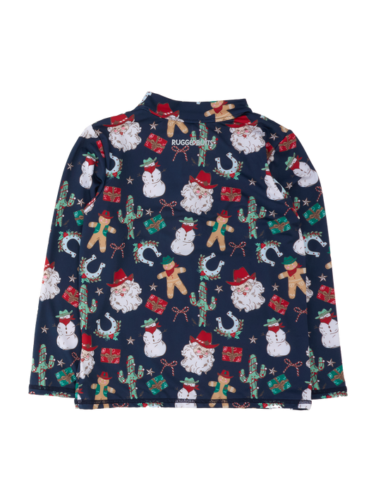 A long-sleeve children's shirt in navy blue with an all-over Christmas print featuring Santa Claus, snowmen, gingerbread men, cactus plants, and gifts, shown flat against a white background.