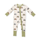 A baby's long-sleeve footless sleep suit with a front zipper, featuring an all-over tractor print on an off-white background with sage green cuffs and leg cuffs.