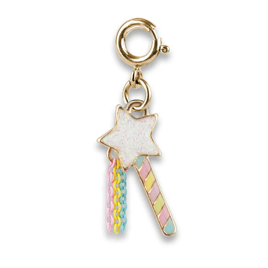 Gold charm with a star and colorful handle 