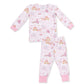 A two-piece children's pajama set by Princess Design, featuring a long-sleeve top and matching pants in light pink with an all-over whimsical print of unicorns, castles, carriages, and hot air balloons, finished with solid pink cuffs.