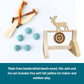 Wooden slingshot set with felt pellets and target on a white background