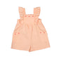 Peach-colored romper with bow 