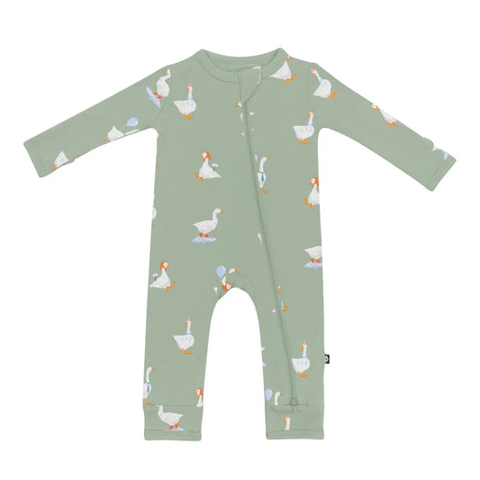 Green baby romper with duck pattern