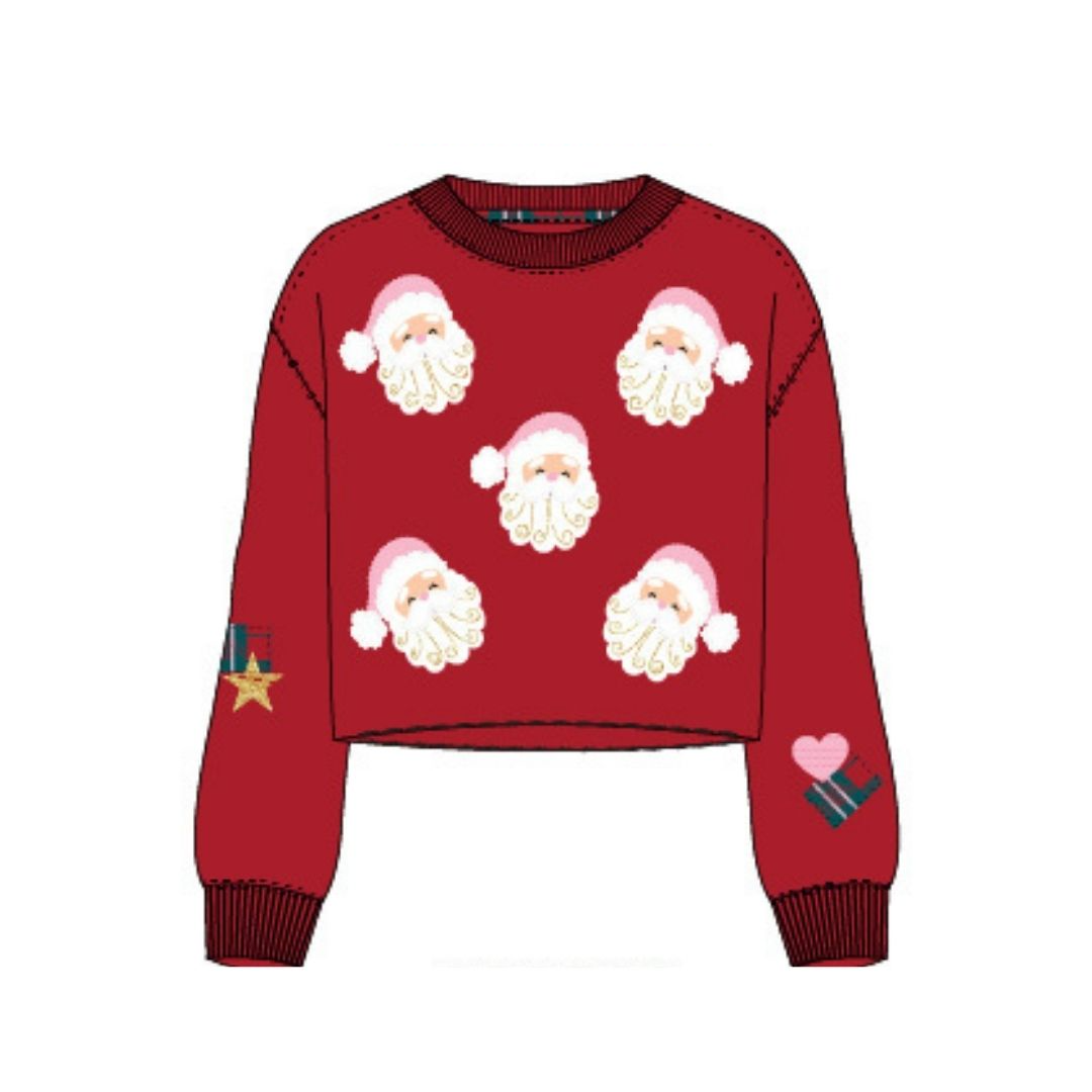 A red long-sleeve cropped sweater with an all-over Santa Claus face pattern, ribbed crew neck, cuffs, and hem, plus small holiday-themed patches on both sleeves, shown on a plain white background.