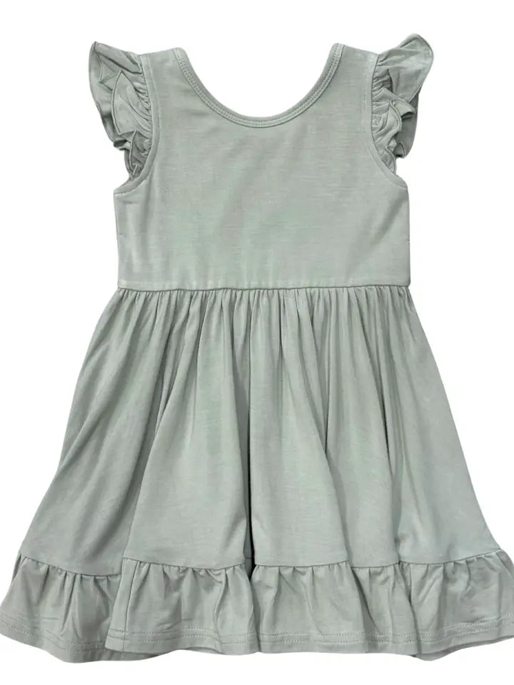 Light green dress with ruffled sleeves and bottom 
