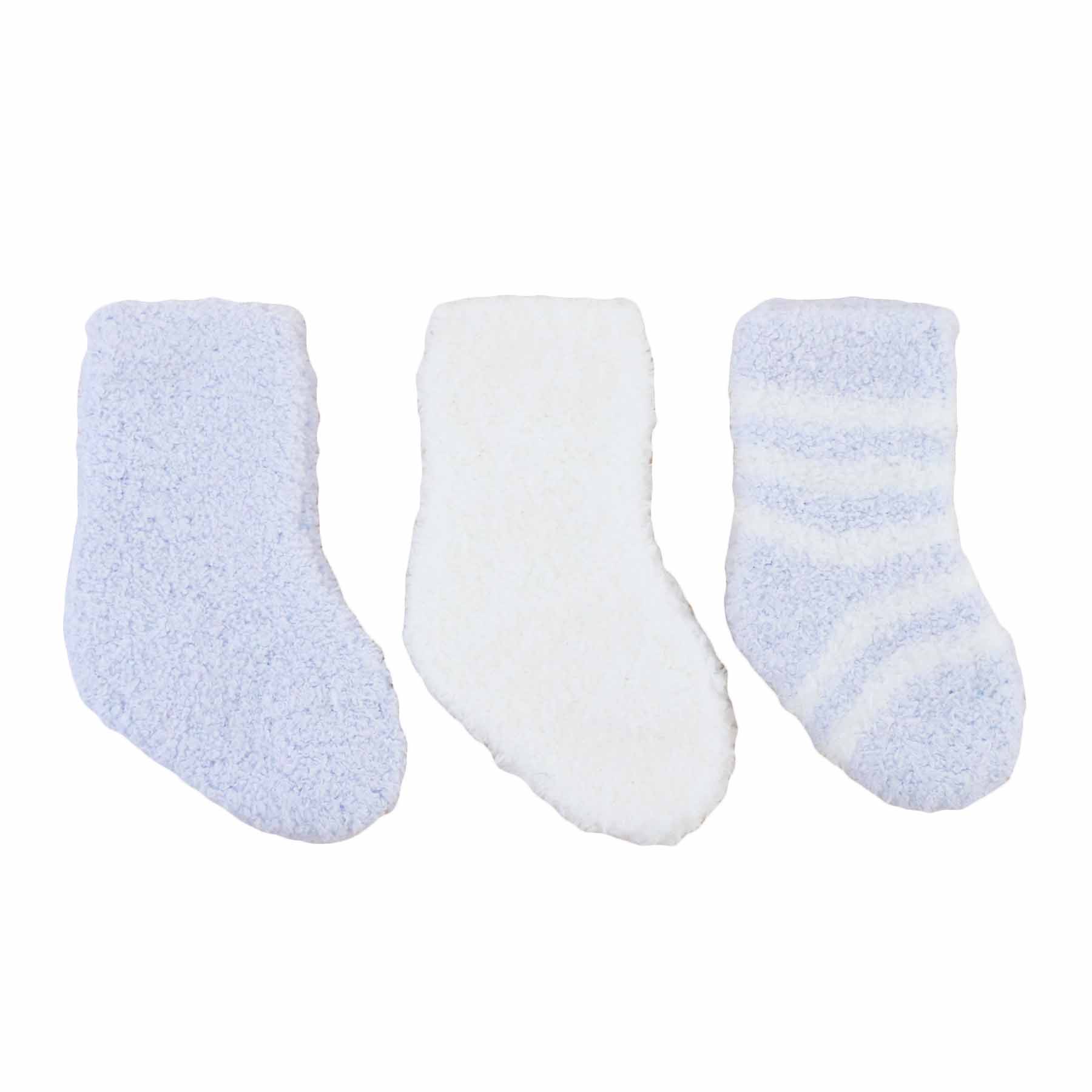 Three pairs of baby socks in blue, white, and striped patterns 