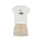 White t-shirt with palm tree design and beige shorts 