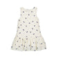 White dress with small navy bow patterns 