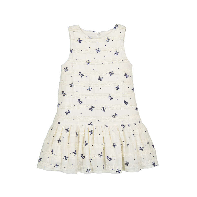 White dress with small navy bow patterns 