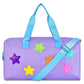 A lavender purple duffel bag with light blue handles and strap, decorated with five colorful glittery star patches in purple, green, orange, yellow, and pink, shown on a white background.