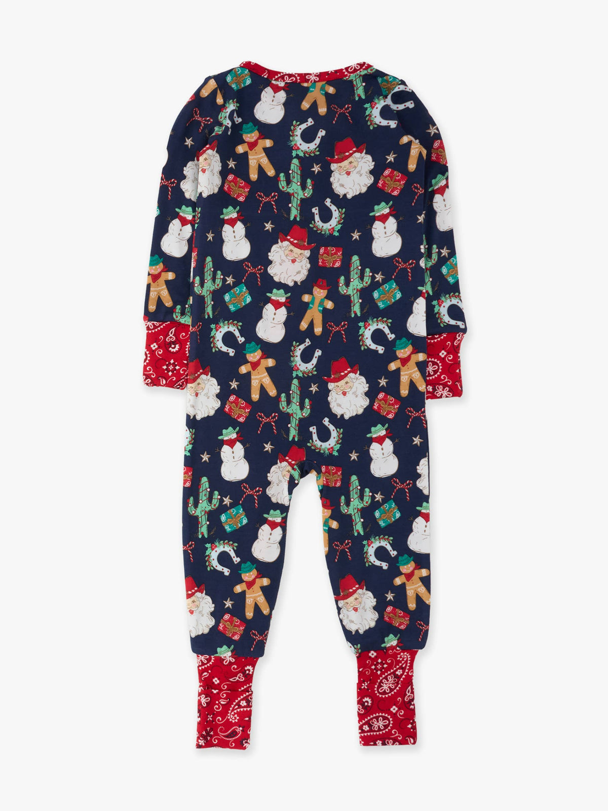 A children's long-sleeve footed one-piece pajama in navy blue with a festive Christmas print of Santa Claus, cacti, snowmen, gingerbread cookies, and gifts, finished with contrasting red cuffs and bandana-patterned ankle openings.