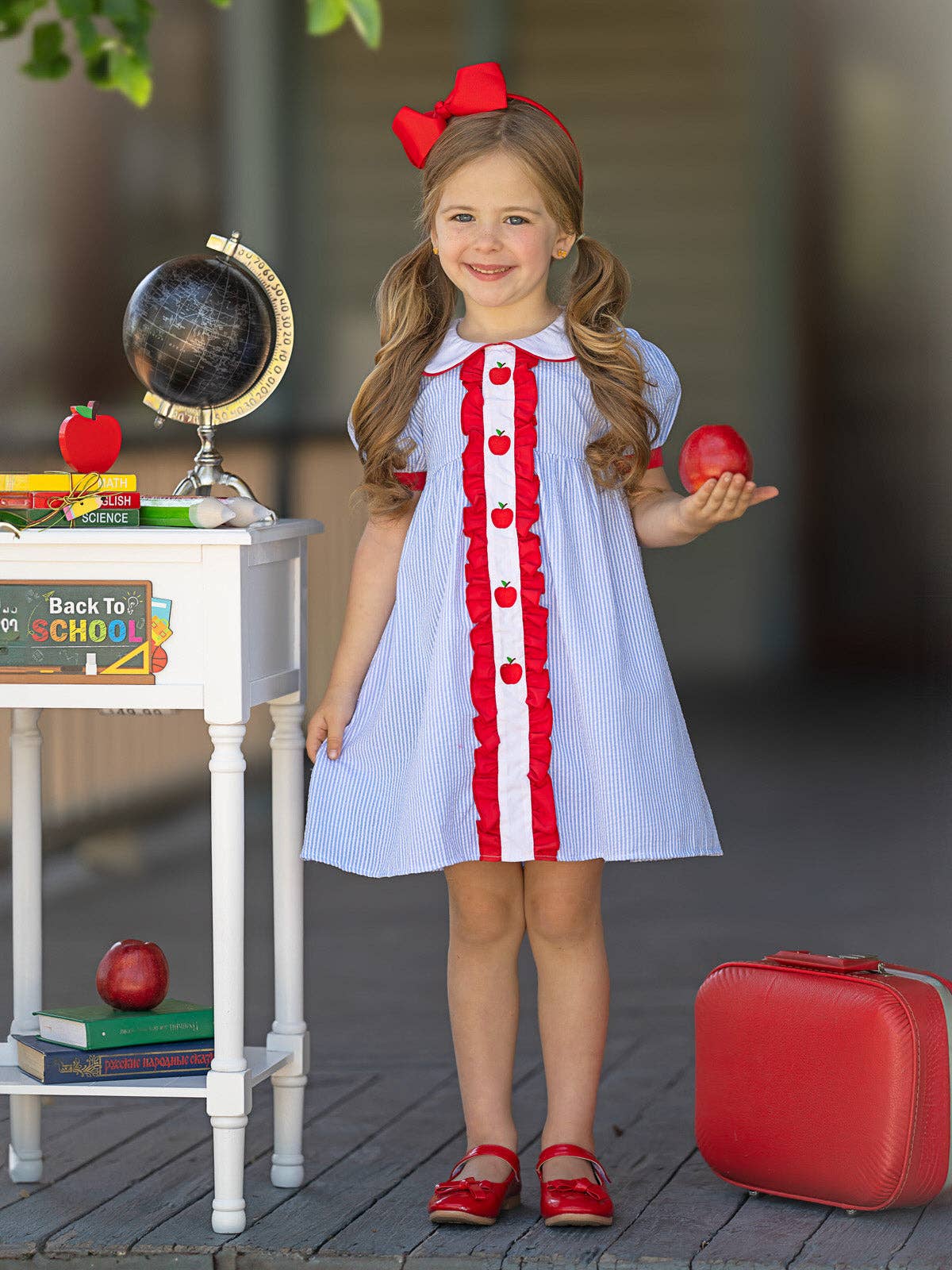 Blue pin stripe dress with apple details