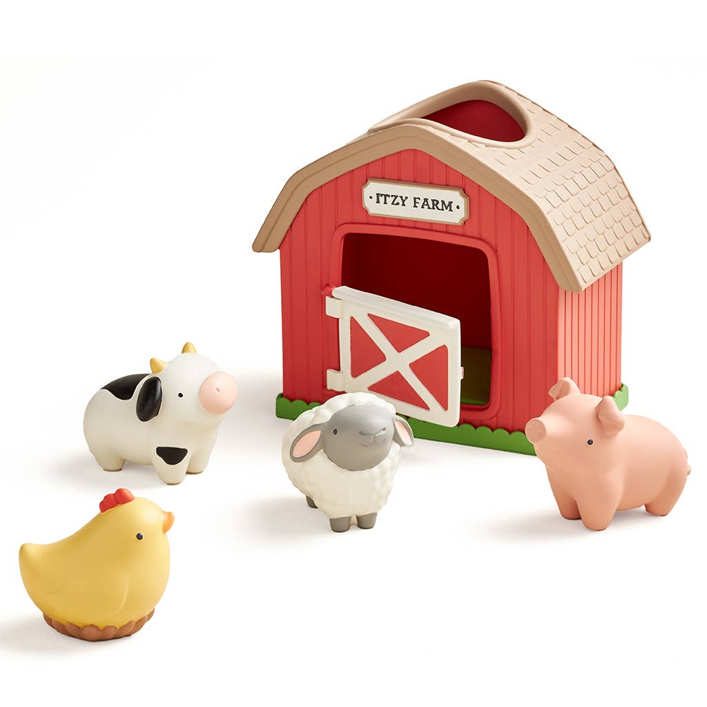 A children's farm play set featuring a red barn with a beige roof, a white sign reading 'Fizzy Farm,' and four small animal figures: a black-and-white cow, a white sheep with gray ears, a pink pig, and a yellow chick.
