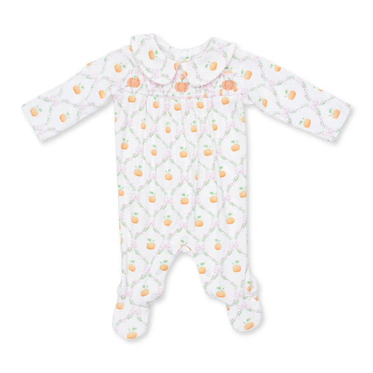 A baby footed sleeper with long sleeves and a Peter Pan collar, featuring a white background with a pink trellis pattern and small orange pears.