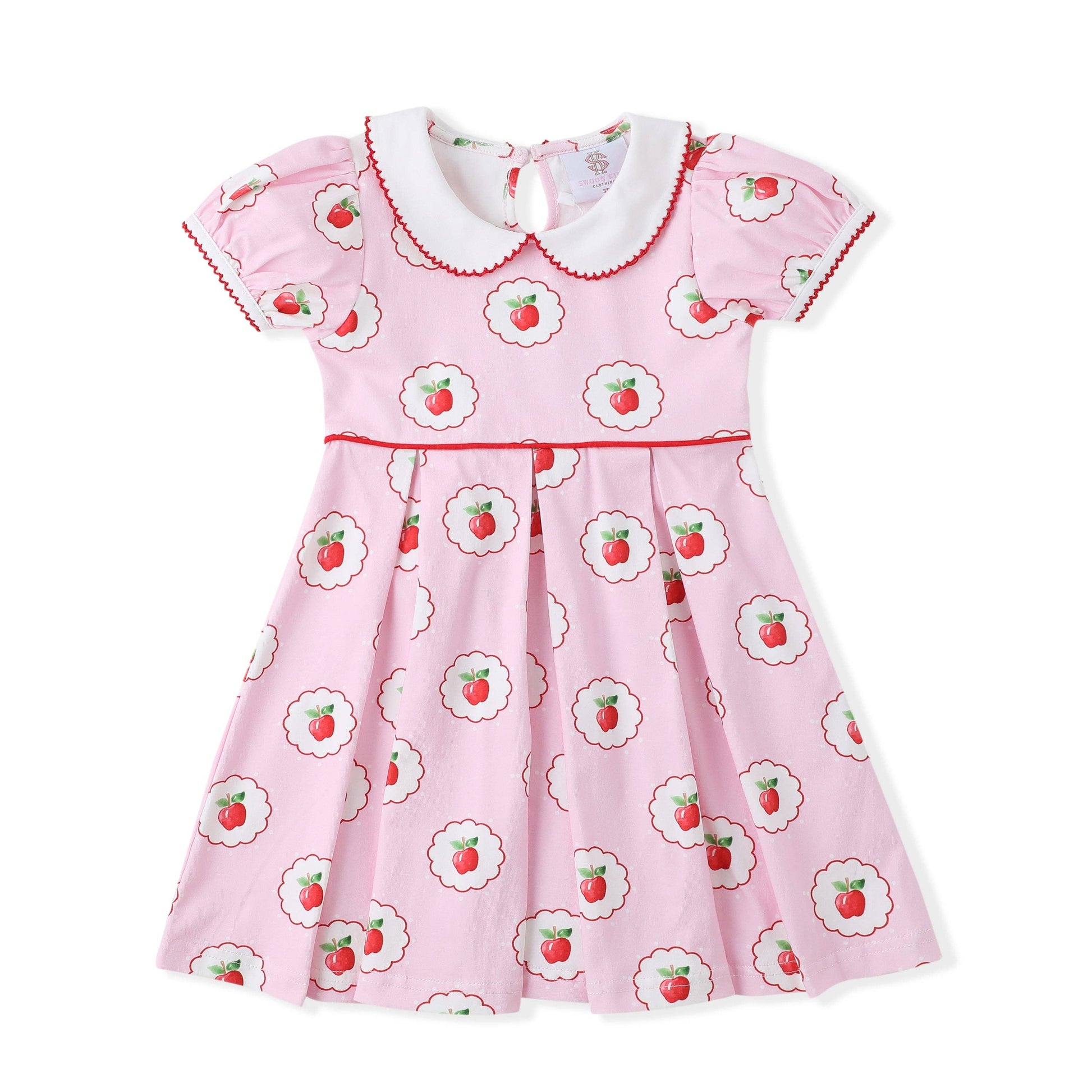 Pink dress with apple details.