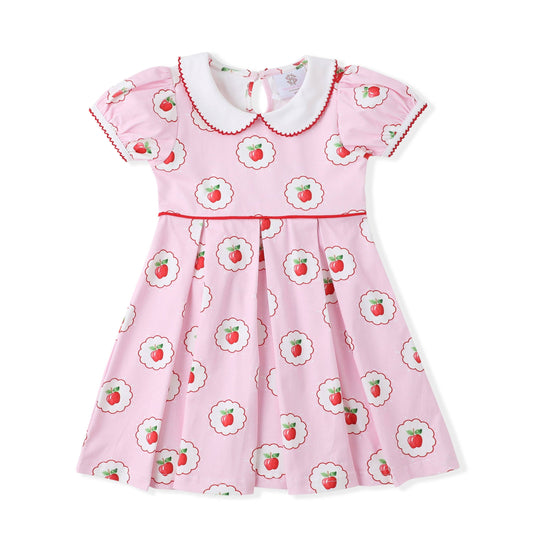 Pink dress with apple details.