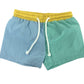 Two-tone shorts with a yellow waistband and blue and green panels 