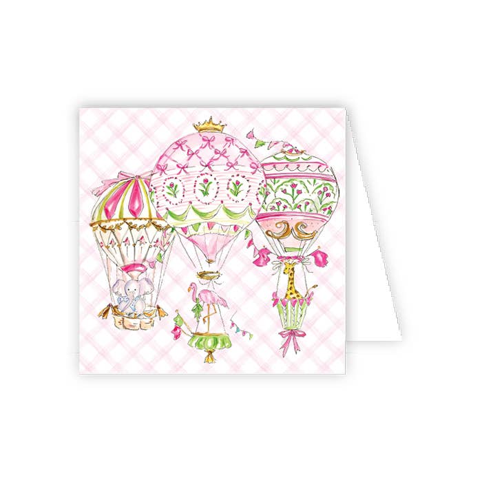 Greeting card with pink hot air balloons and baby elements on a checkered background