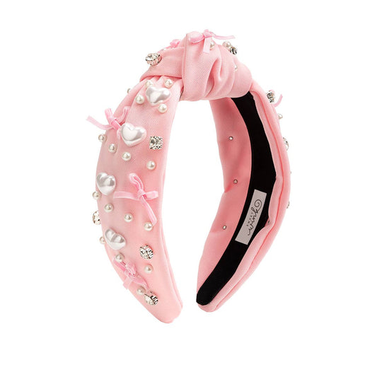 Pink headband with pearl heart embellishments