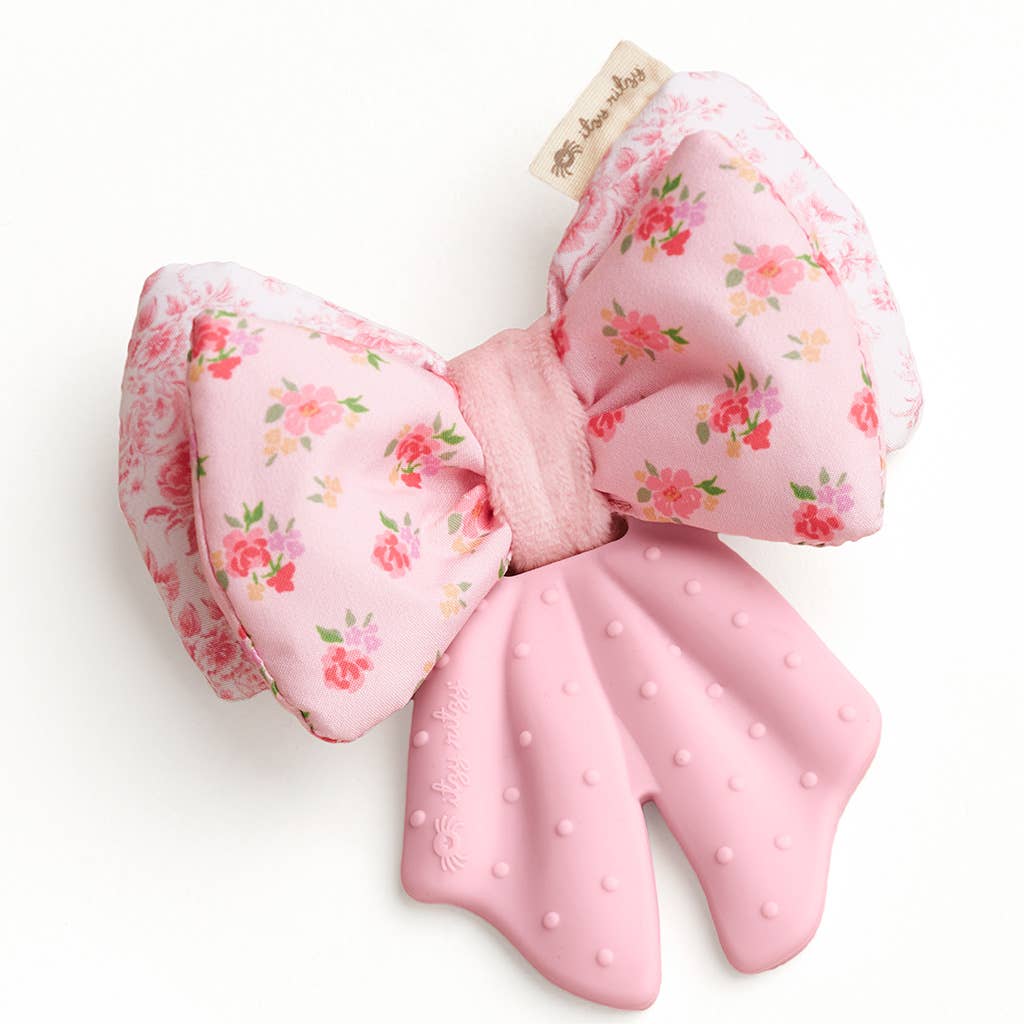 Floral-patterned bow with pink teething tail