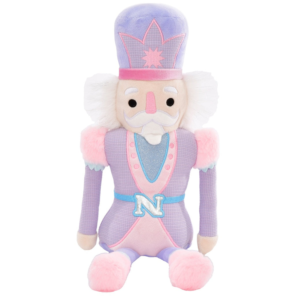 Nutcracker Plush with a purple outfit and pink accents