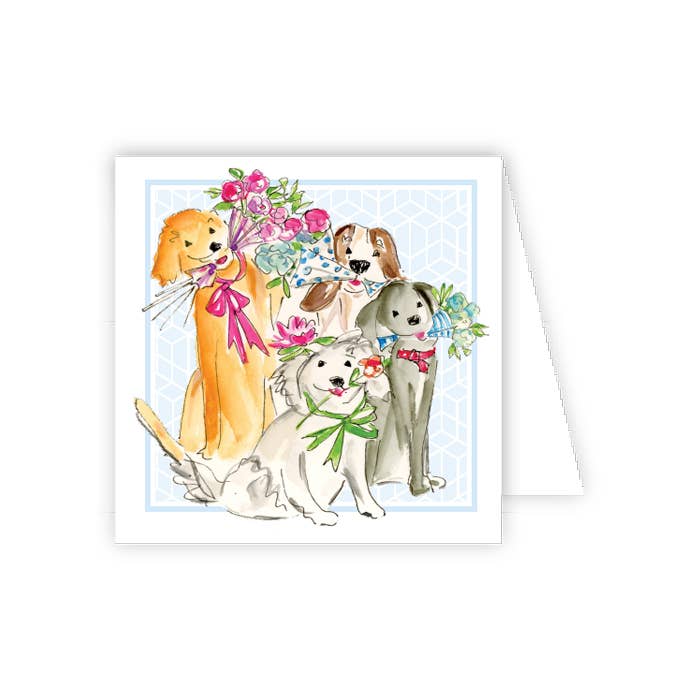 Four puppies holding flowers on a card