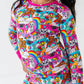 Child wearing a colorful pajama set with cartoon characters on a white background