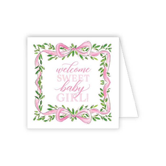 Greeting card with pink ribbons and green leaves, featuring the text 'welcome sweet baby girl' on a white background.