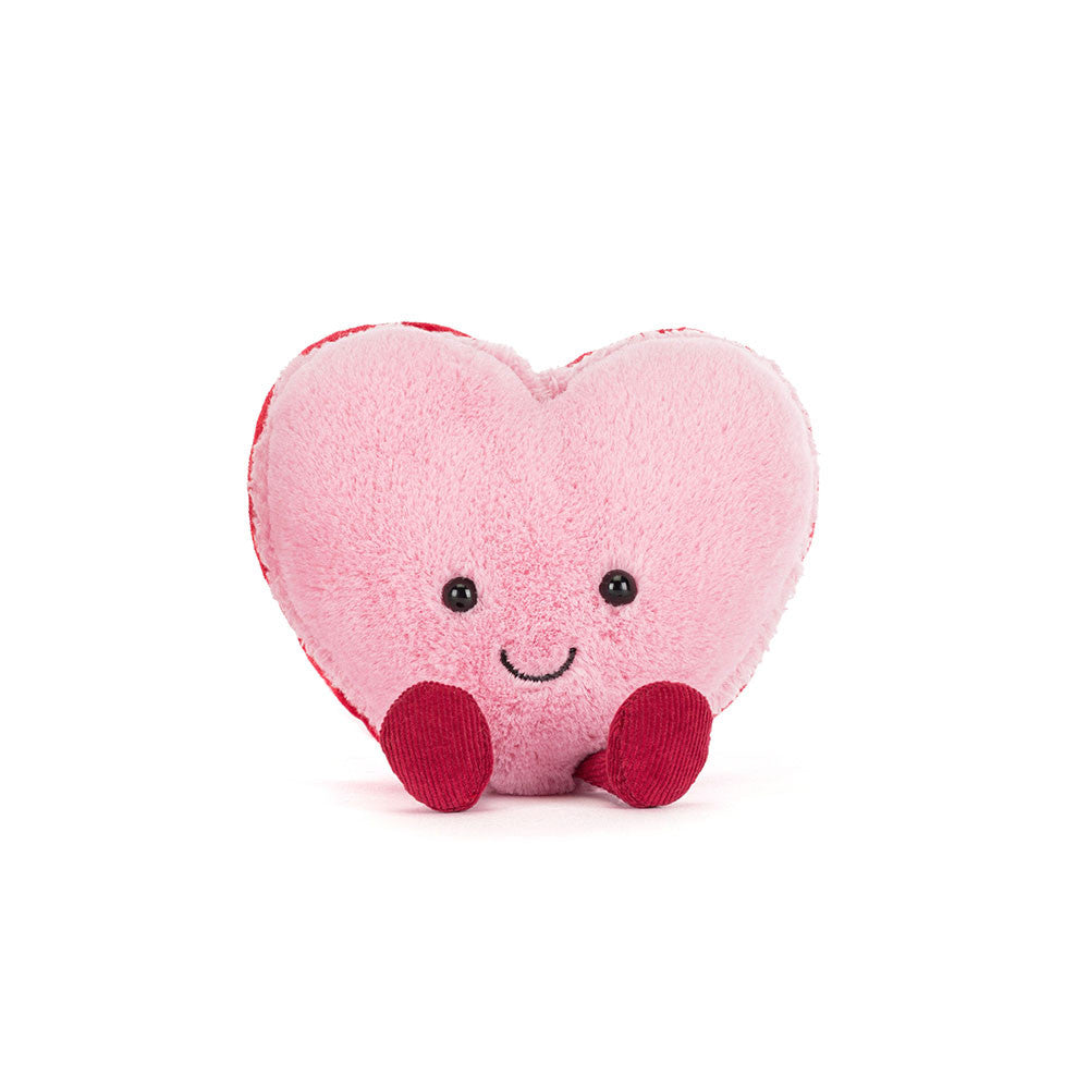 Pink Heart-shaped plush toy with a smiley face 