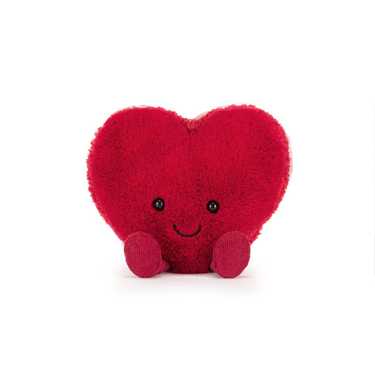 Red heart-shaped plush toy with a smiley face 