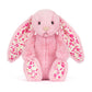 Pink plush bunny with floral patterns 