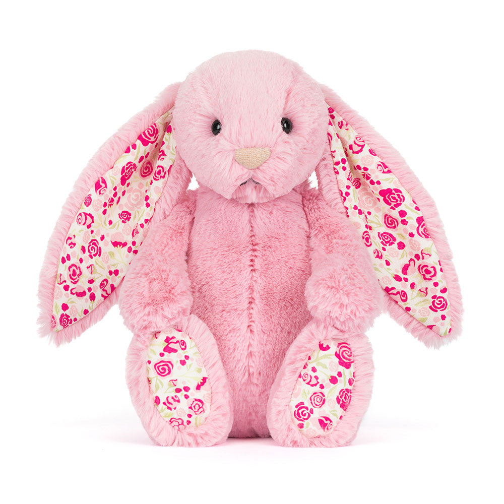 Pink plush bunny with floral patterns 