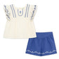 White blouse with blue embroidery and matching blue shorts 