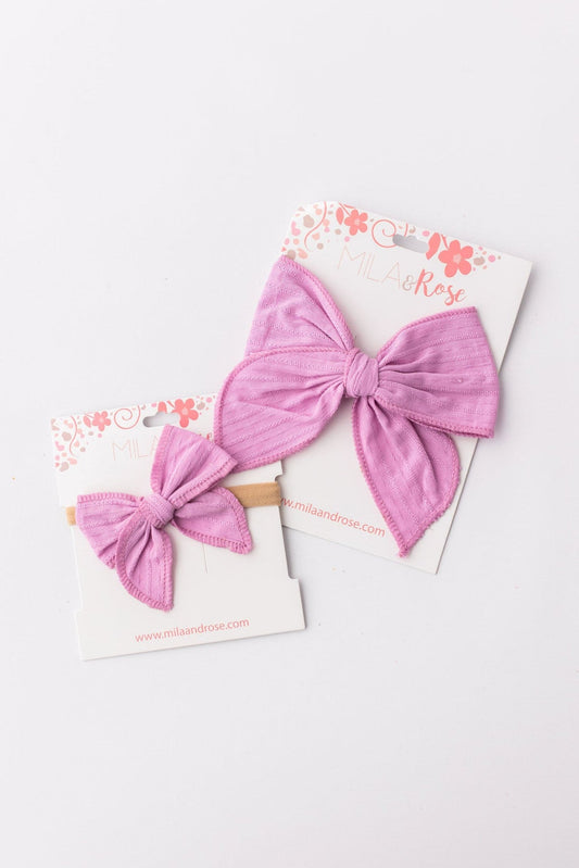 bright lilac hair bows on a floral card