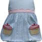 Light blue dress with pink trim and cupcake pockets