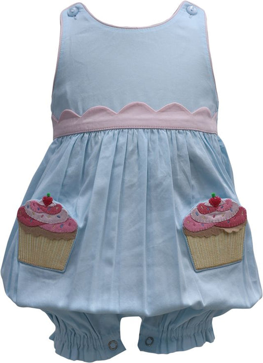 Light blue dress with pink trim and cupcake pockets