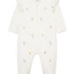 White baby onesie with colorful floral pattern 